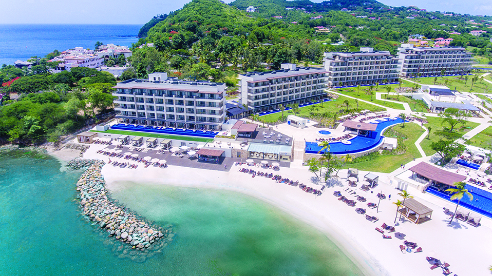 a resort with a pool and a beach
