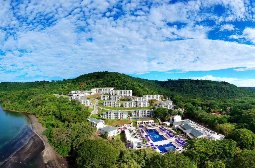 a resort with a pool and trees