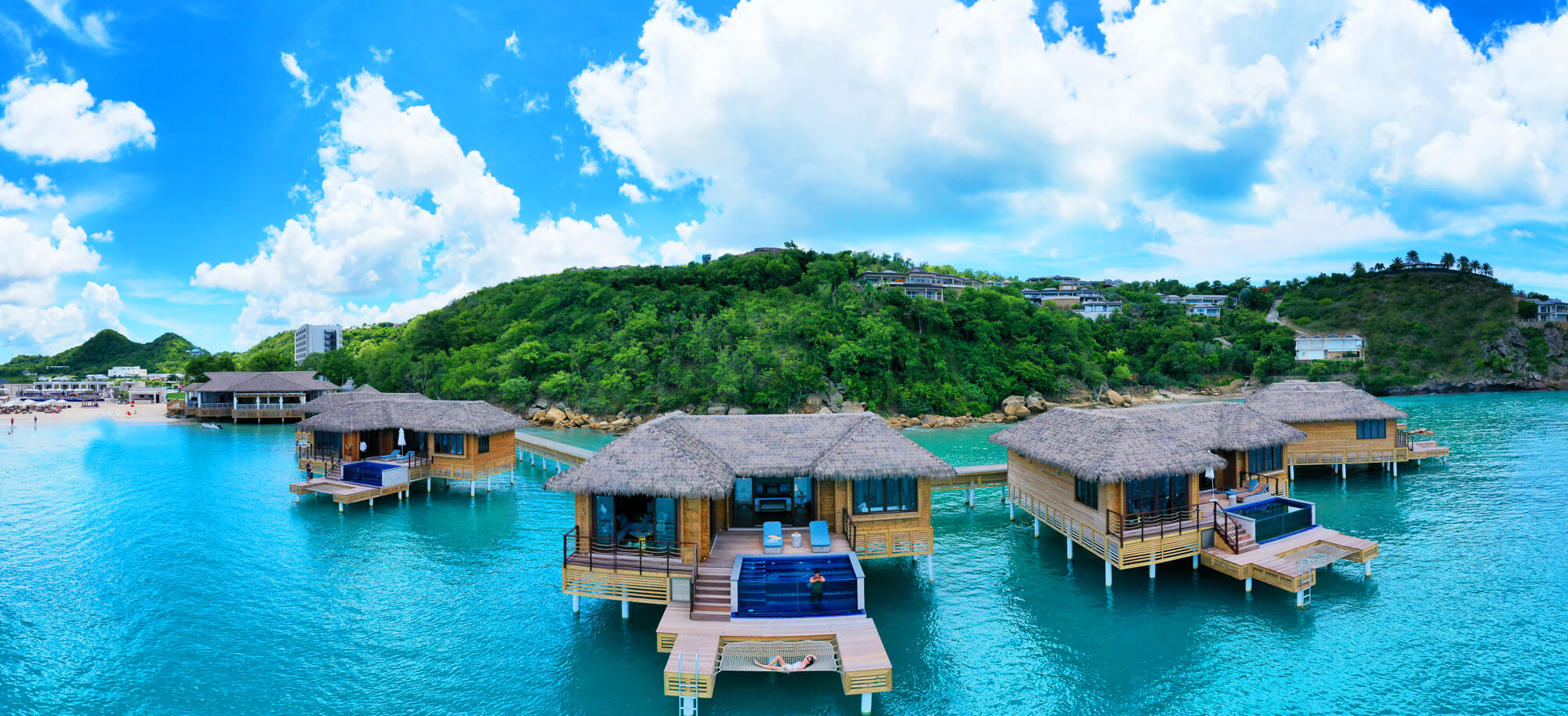 a group of houses on a body of water