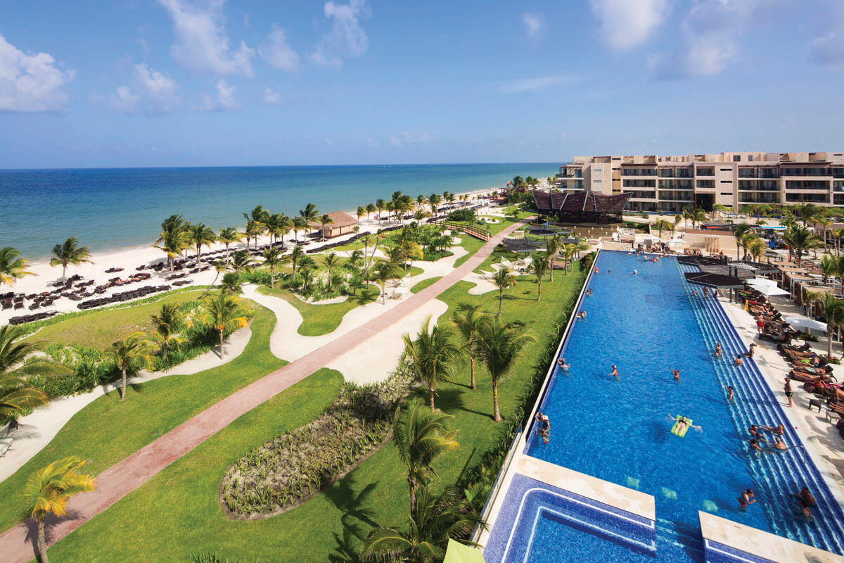 a swimming pool next to a beach