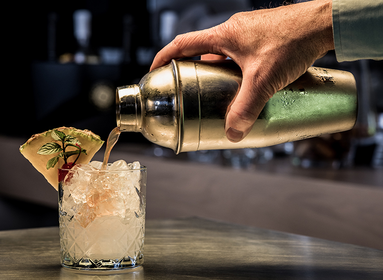 Bartender pouring mixed drink