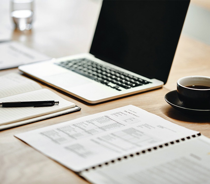 a laptop and coffee on a table