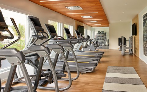 a room with treadmills and exercise equipment
