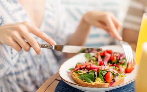 a person eating a plate of food