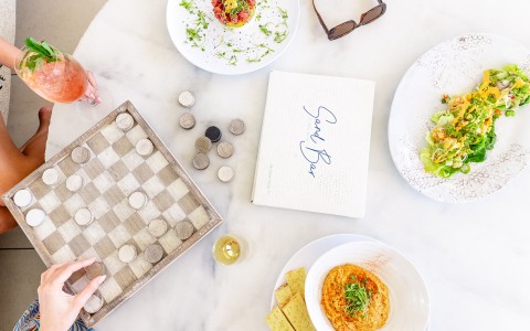 a table with food and a checkerboard