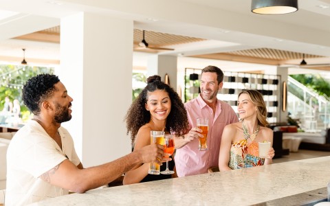a group of people holding drinks
