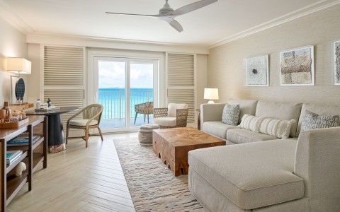 a living room with a large couch and a table