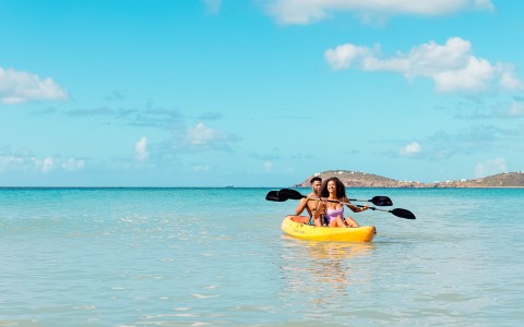 a couple in a kayak on the water