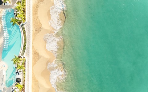 a beach with waves crashing on the shore
