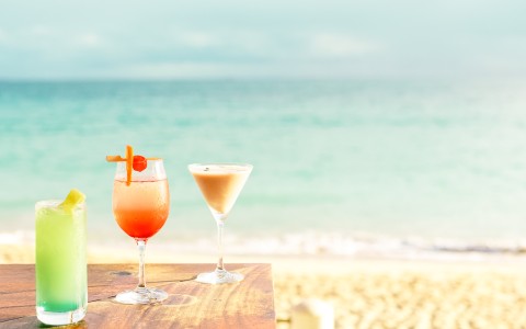 two glasses of drinks on a table