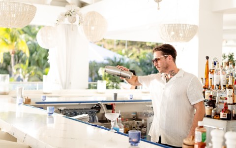 a man holding a shaker
