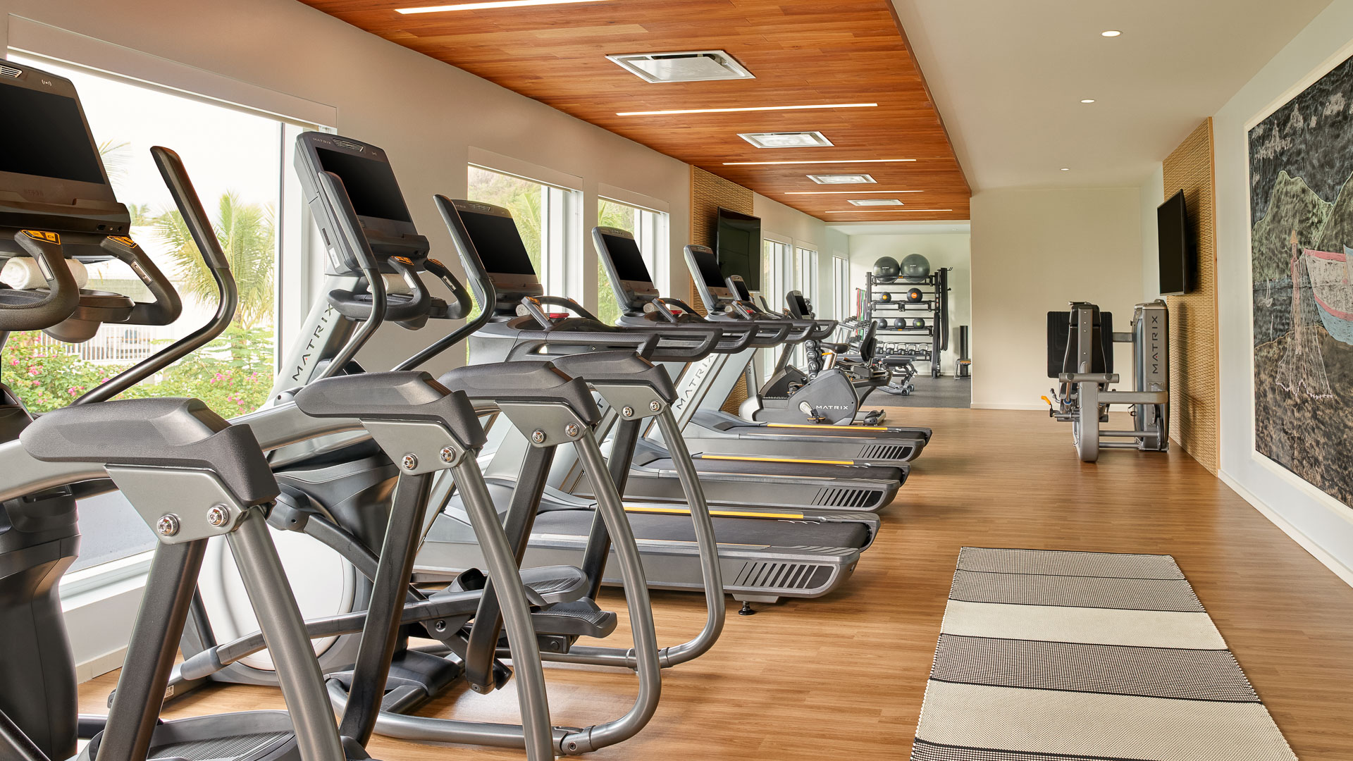 a room with treadmills and exercise equipment