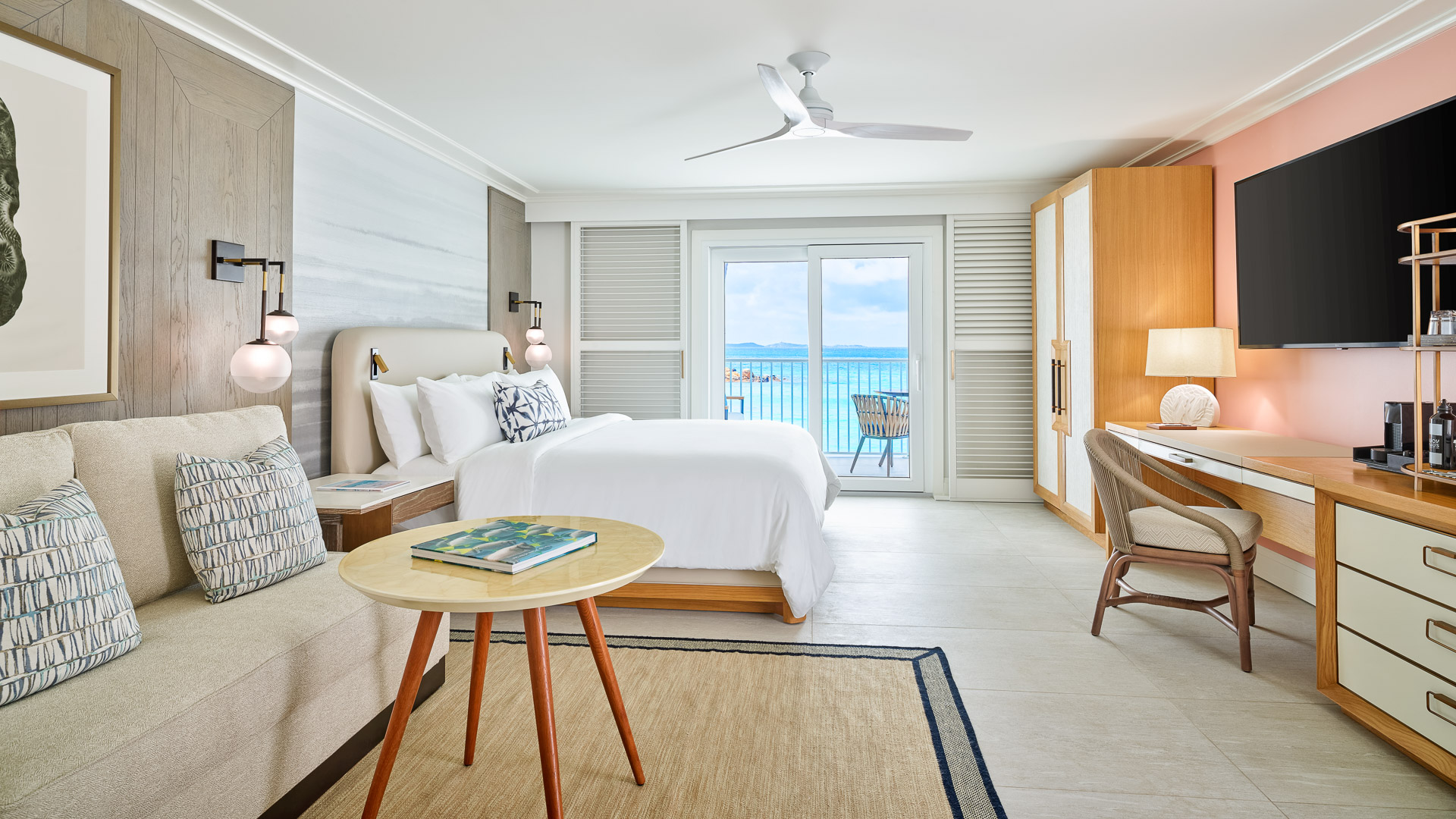 a room with a bed and a table and chairs