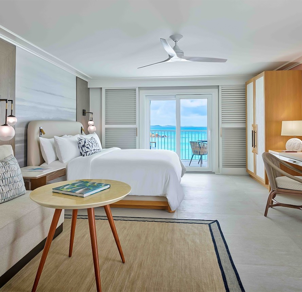 a room with a bed and a desk and a chair