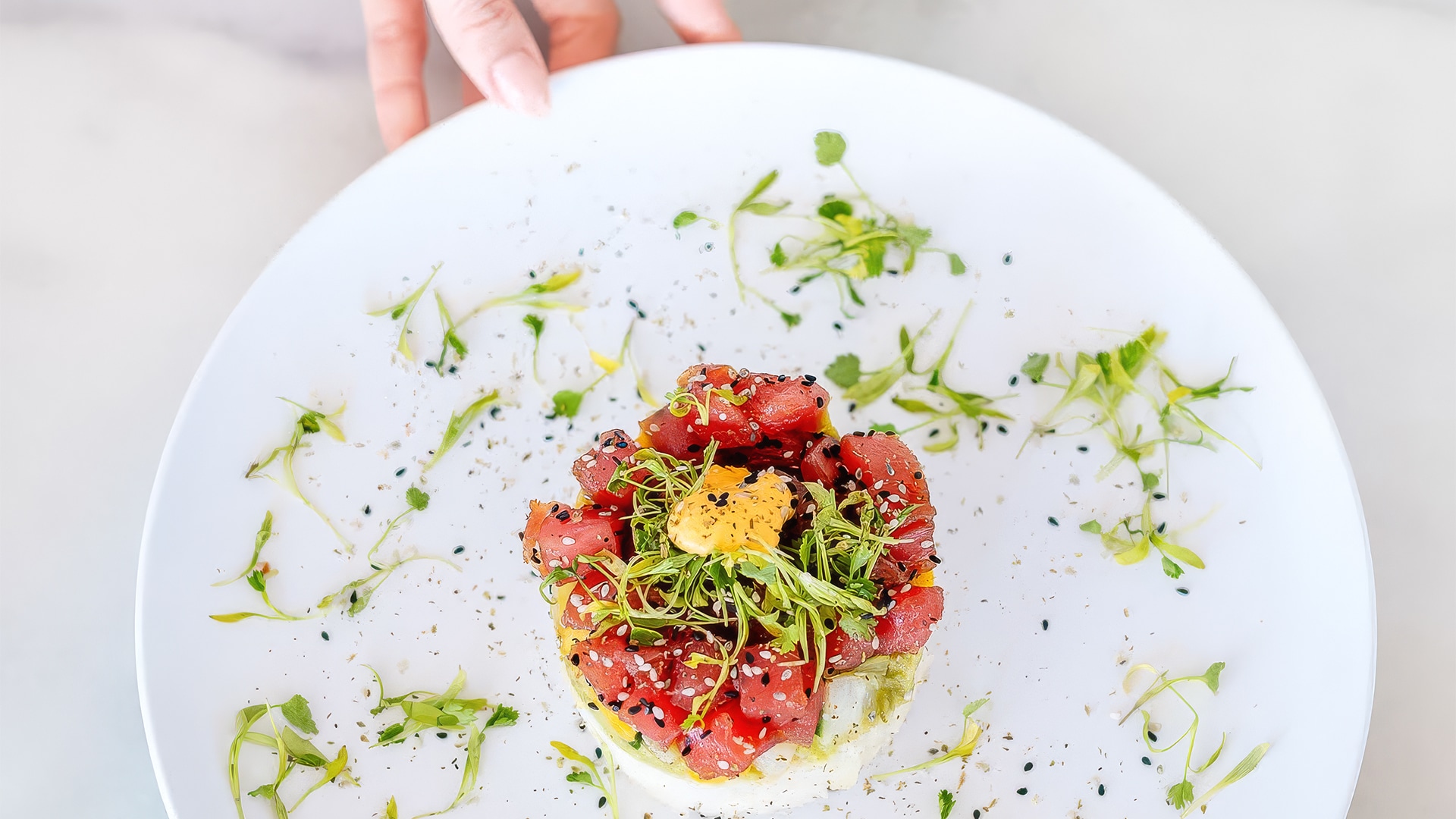 a plate of food with a person holding it