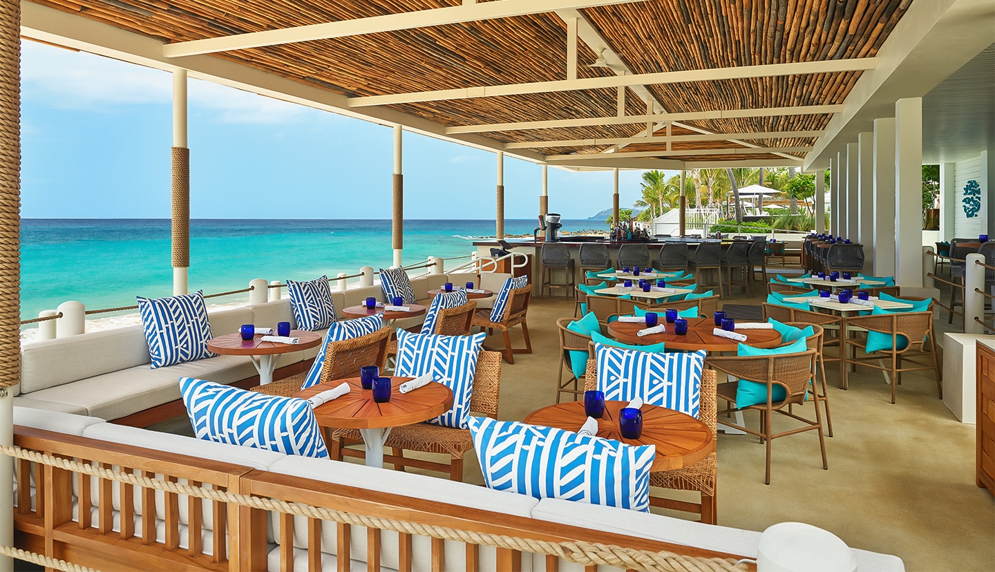 a restaurant with tables and chairs on a patio