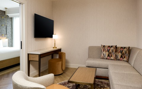 a living room with a tv on the wall