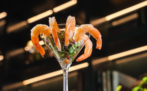 a shrimp in a martini glass