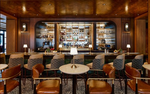 a bar with a table and chairs