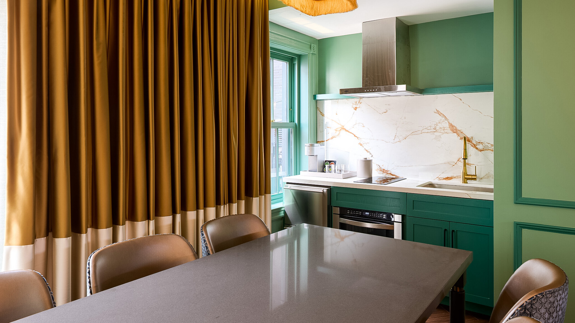 a kitchen with a table and chairs