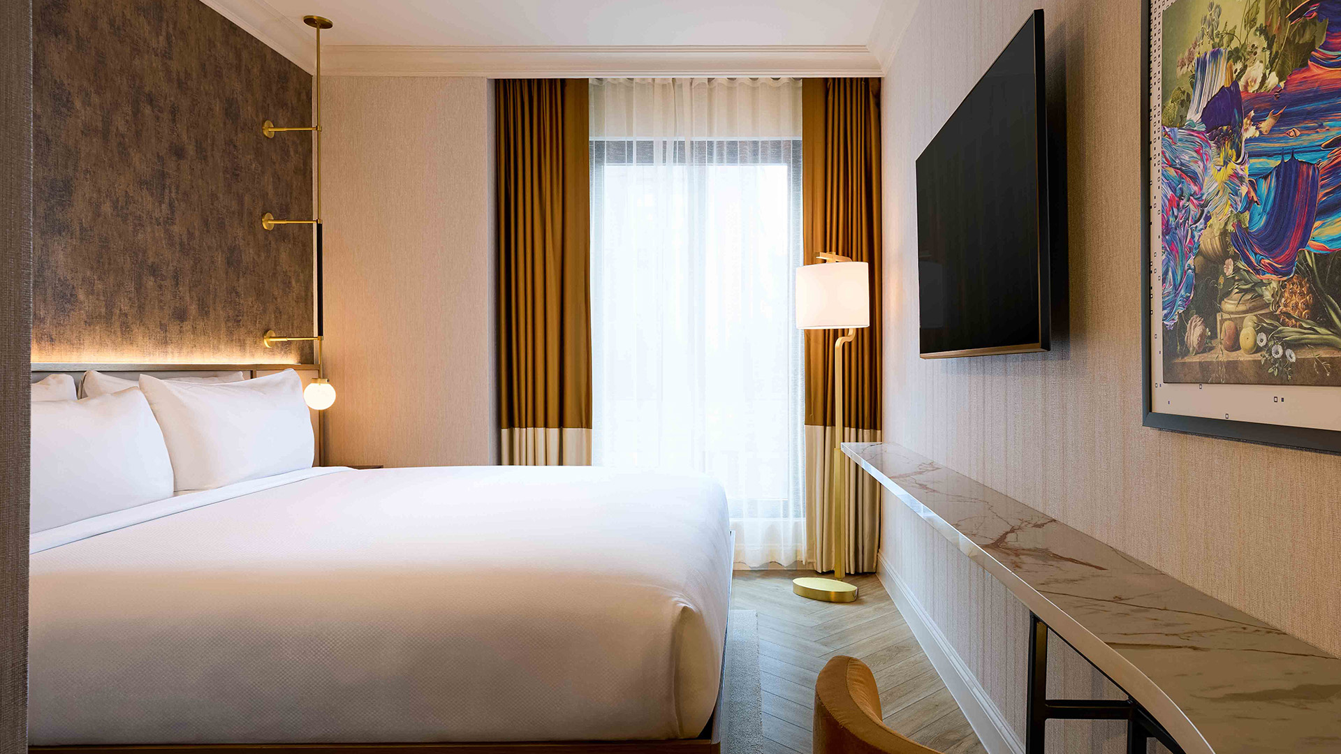 a room with a bed and a tv