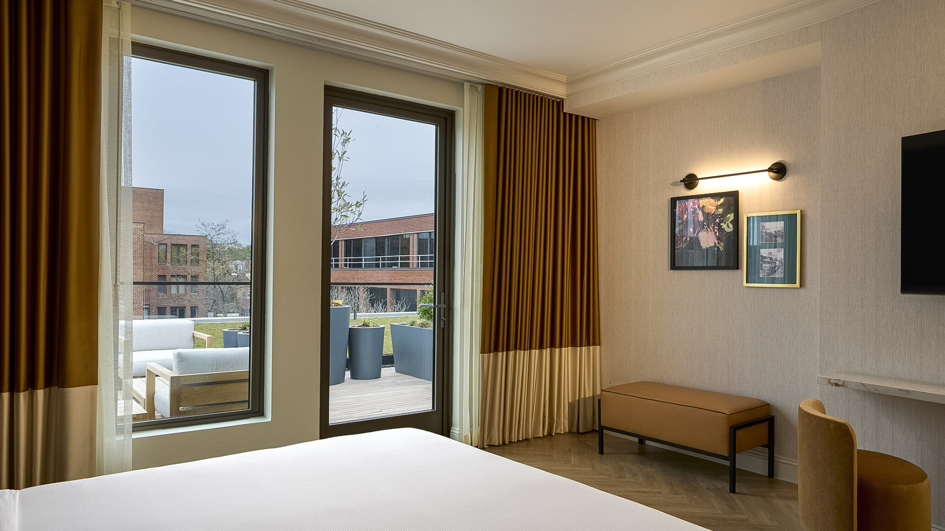 a room with a bed and a bench