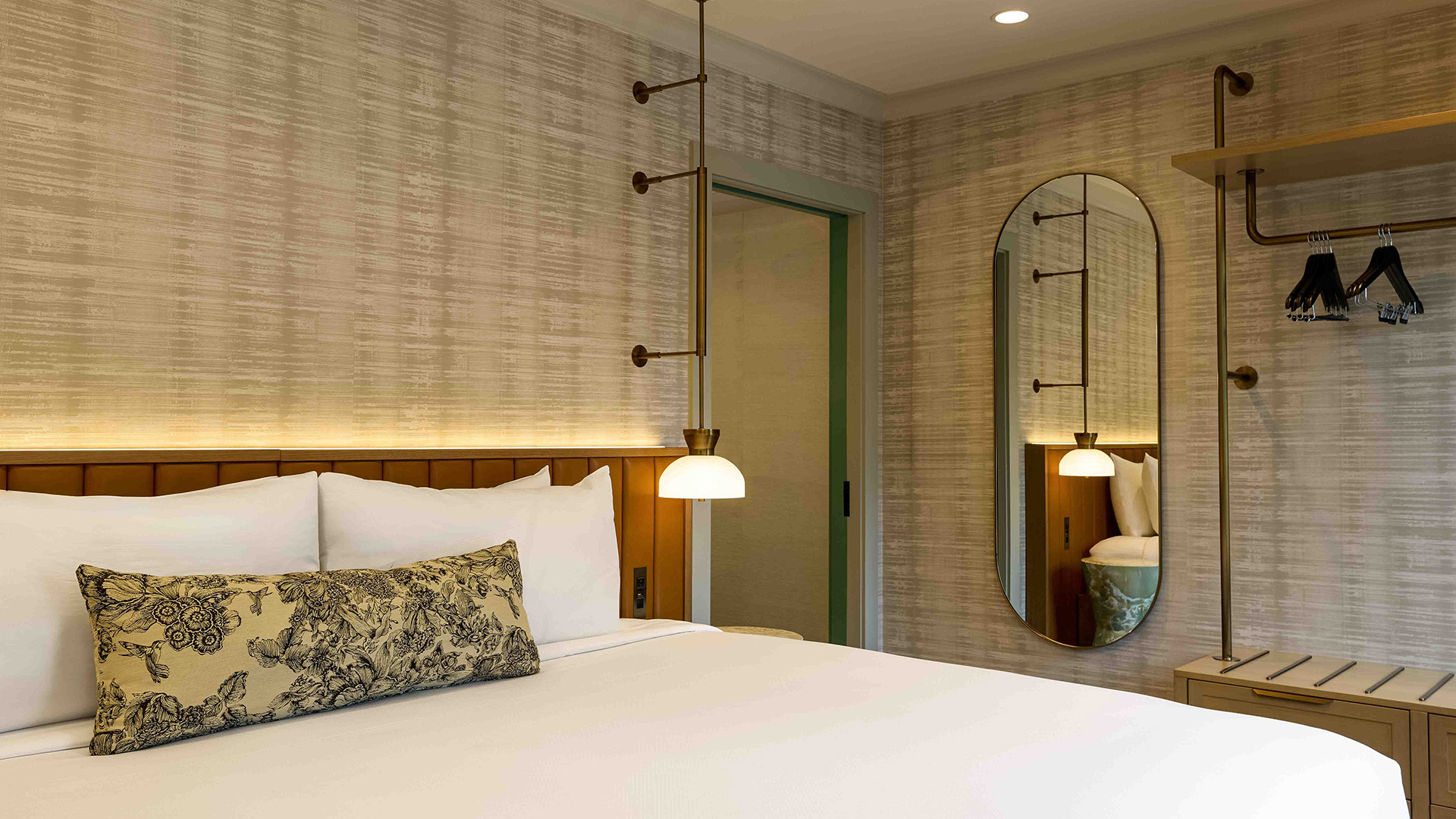 a bed with a mirror and a bed