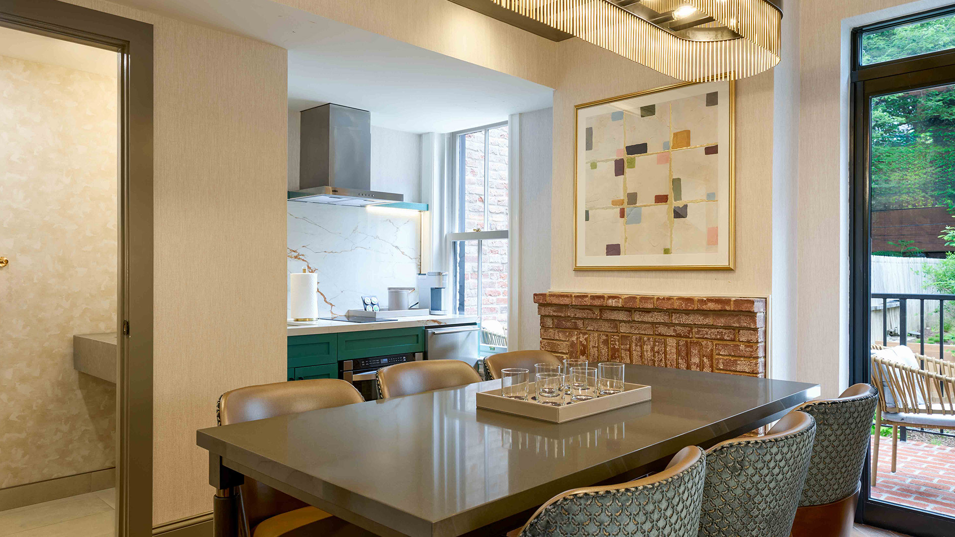 a dining table with chairs in a room