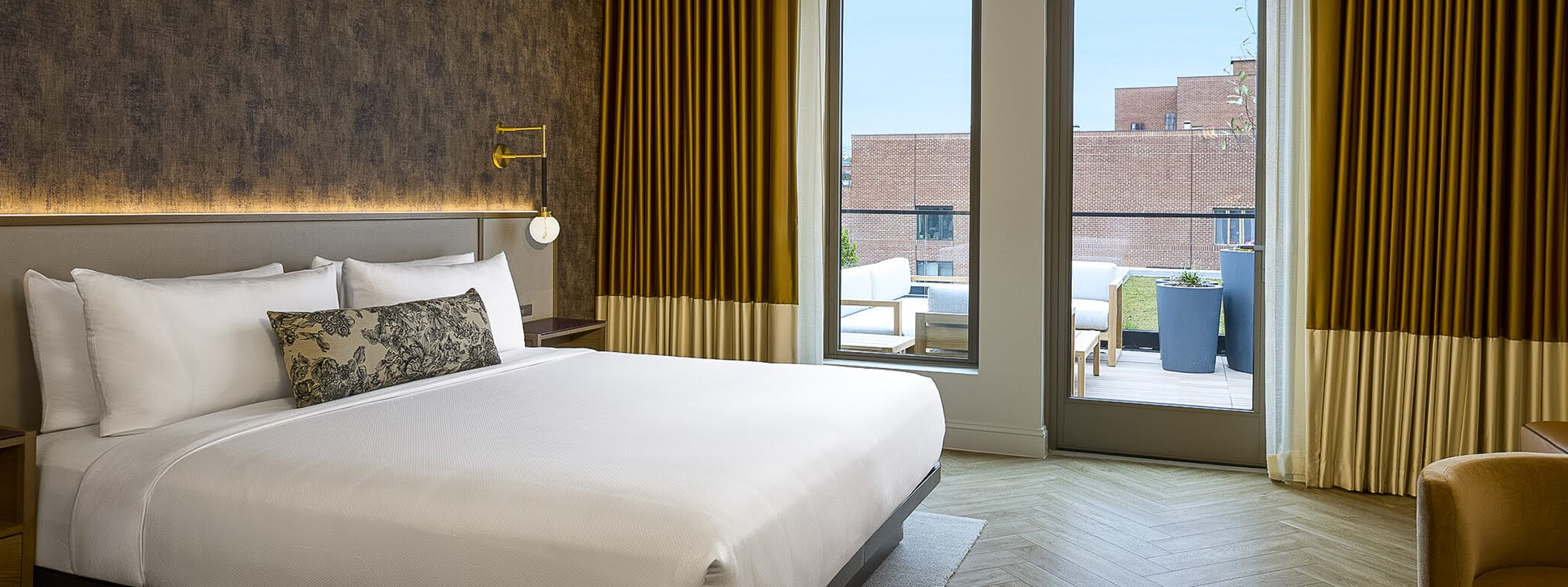 a bed with a pillow and a window