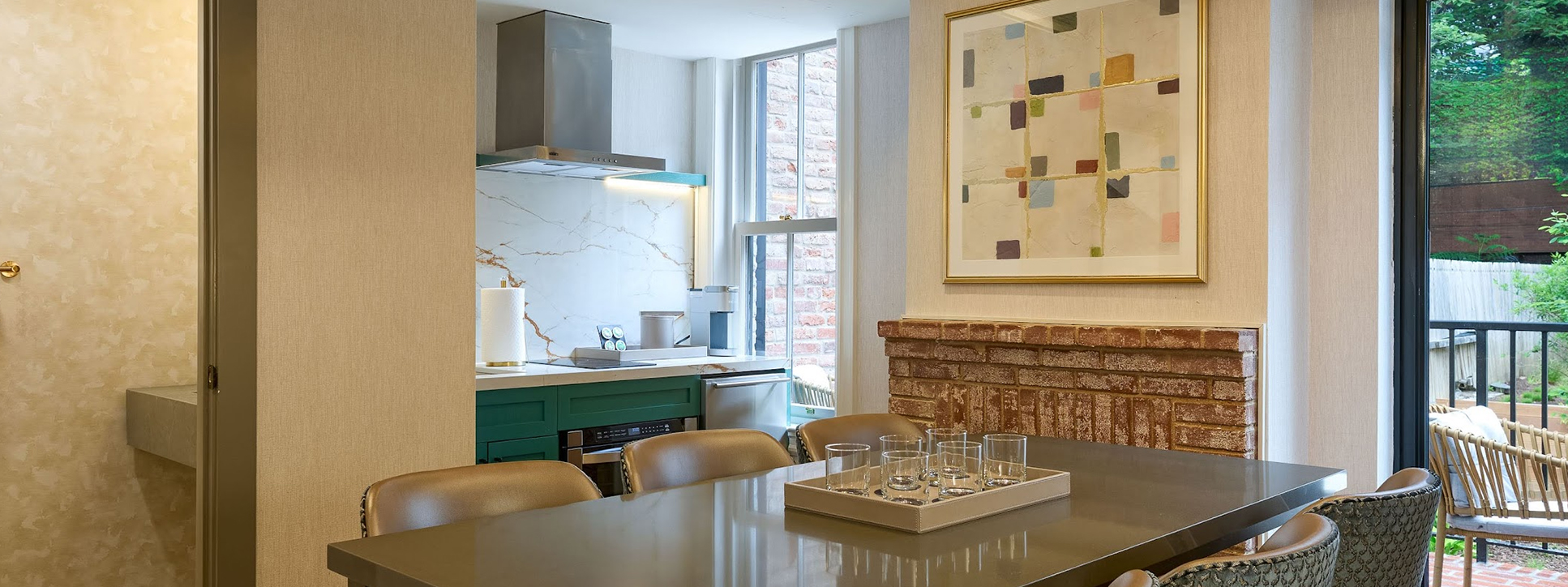 a kitchen with a table and chairs