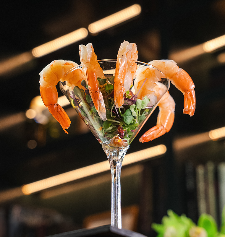 a glass with shrimp in it