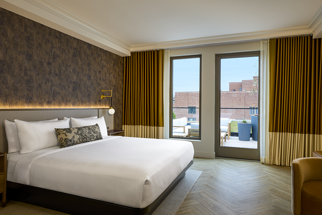 a bedroom with a bed and a door