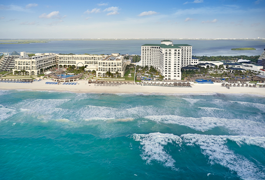 a large building next to a beach