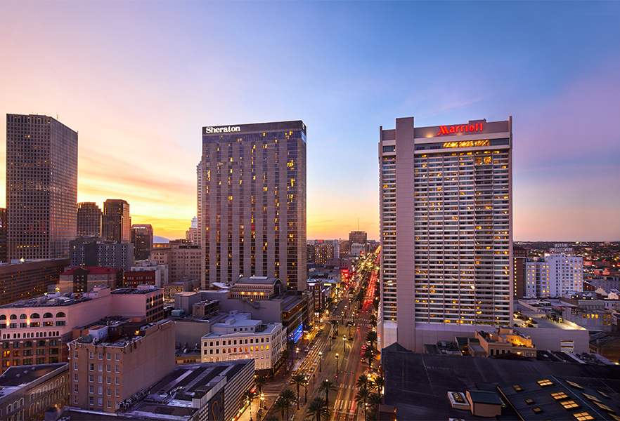 a city with tall buildings and a road