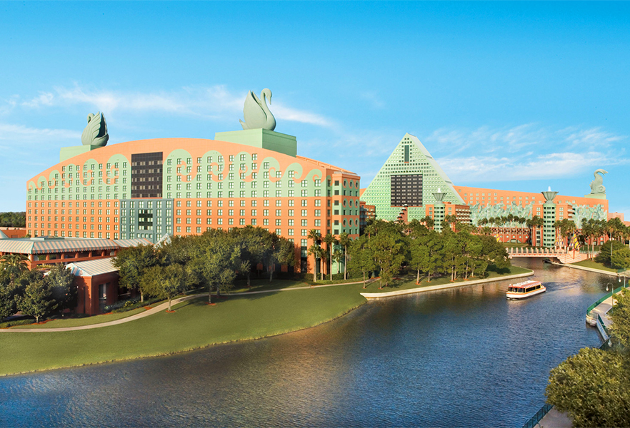 a large building next to a body of water with Walt Disney World Dolphin in the background