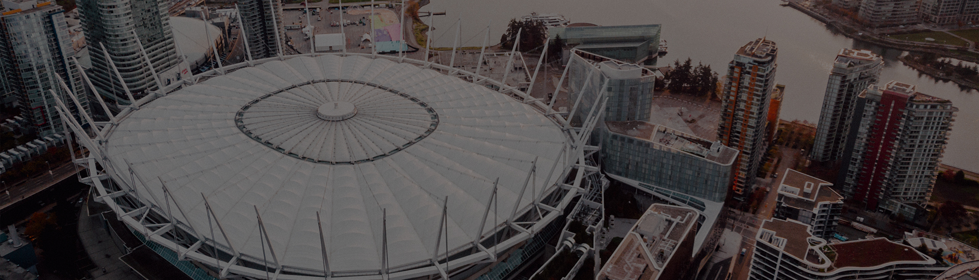 a large white stadium with many windows