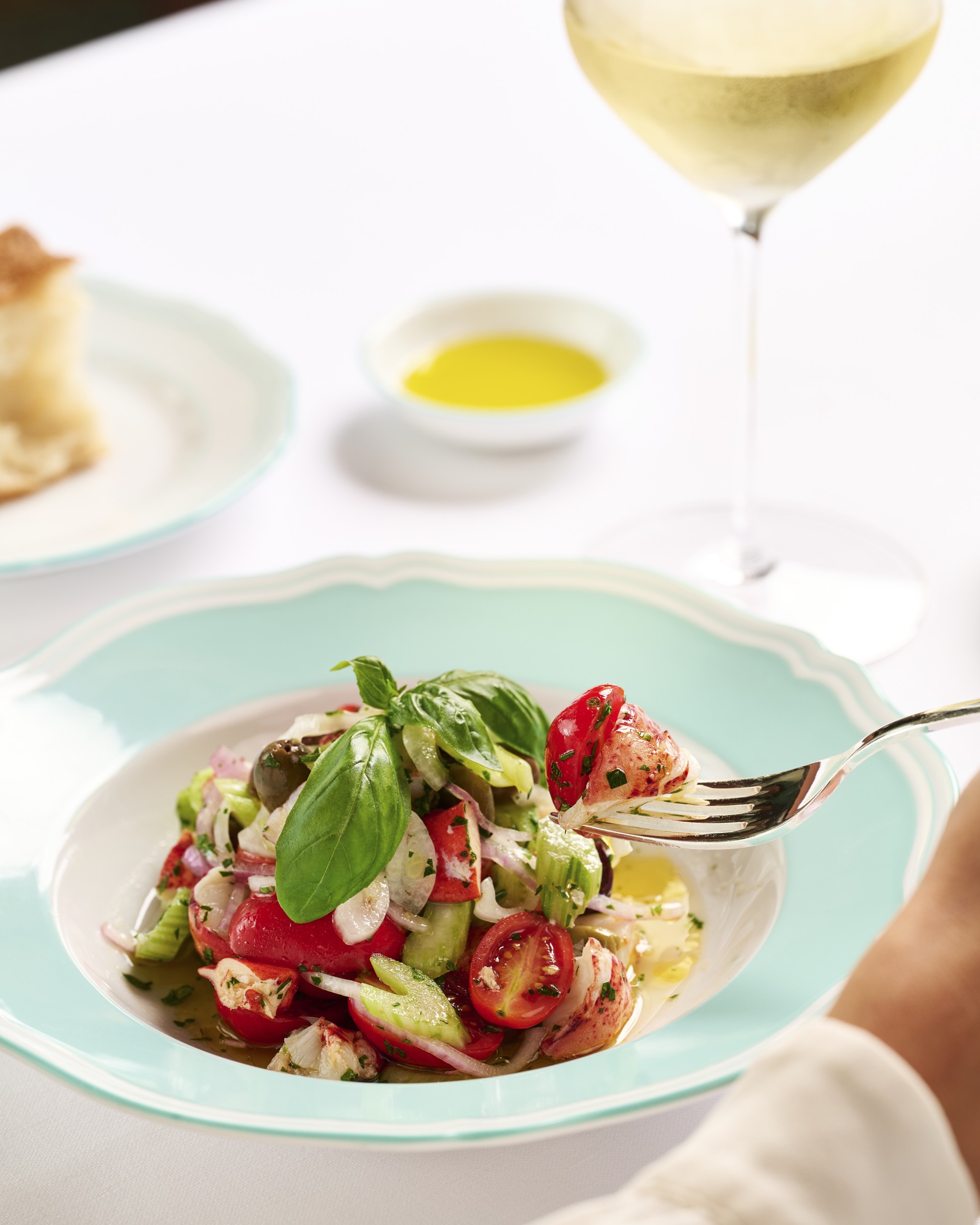 a fork in a bowl of salad
