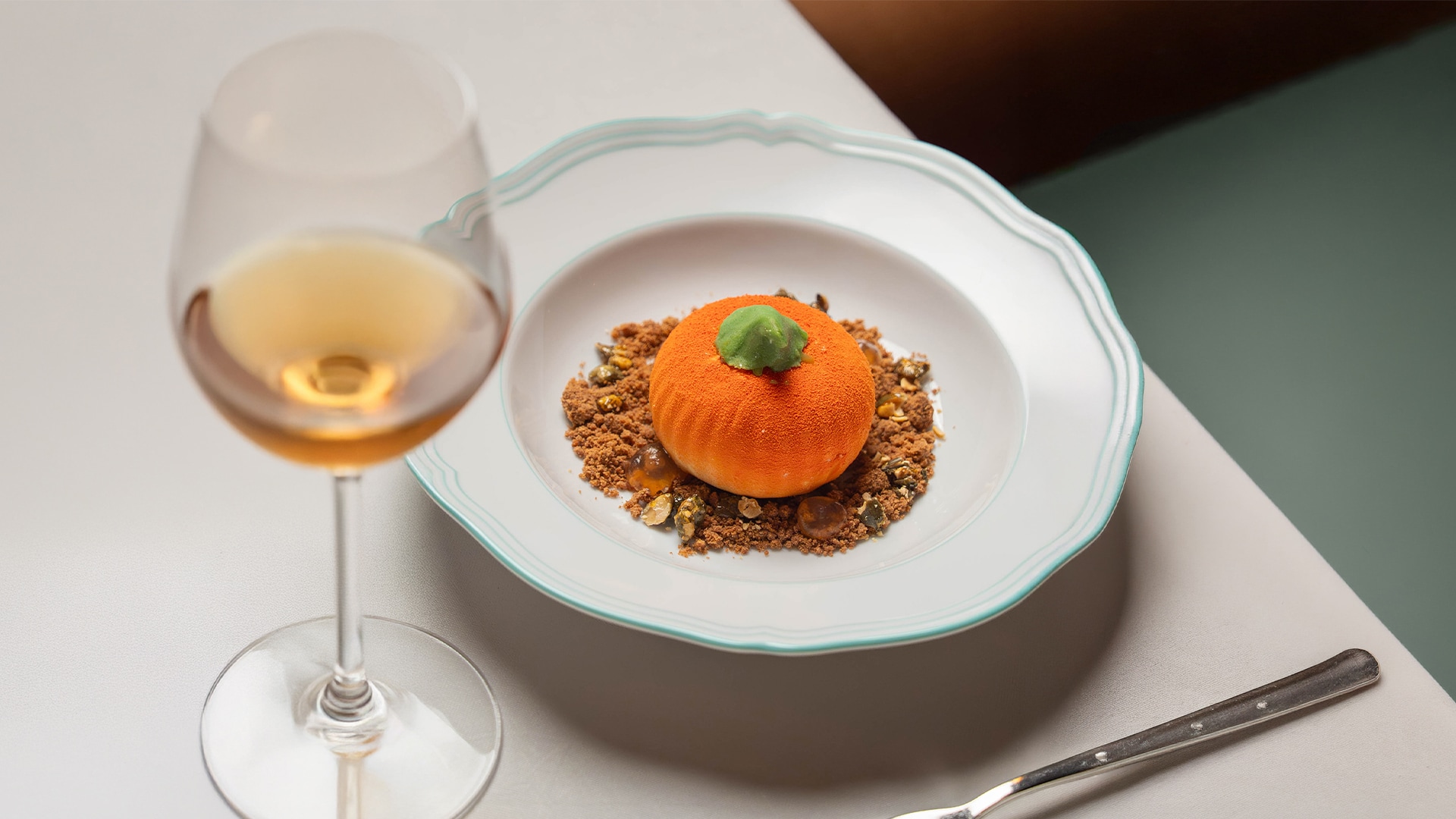 a plate of food and a glass of wine