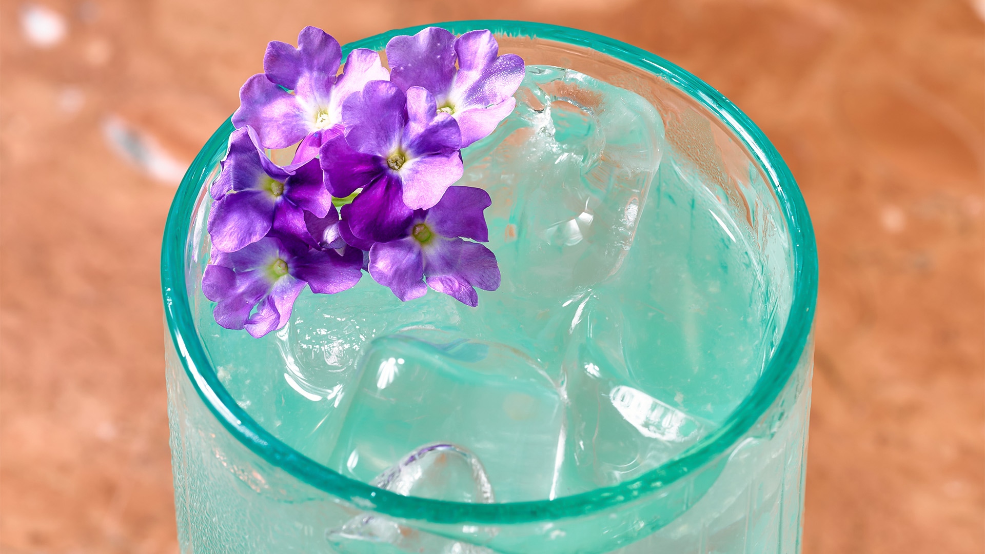 a glass with ice and flowers