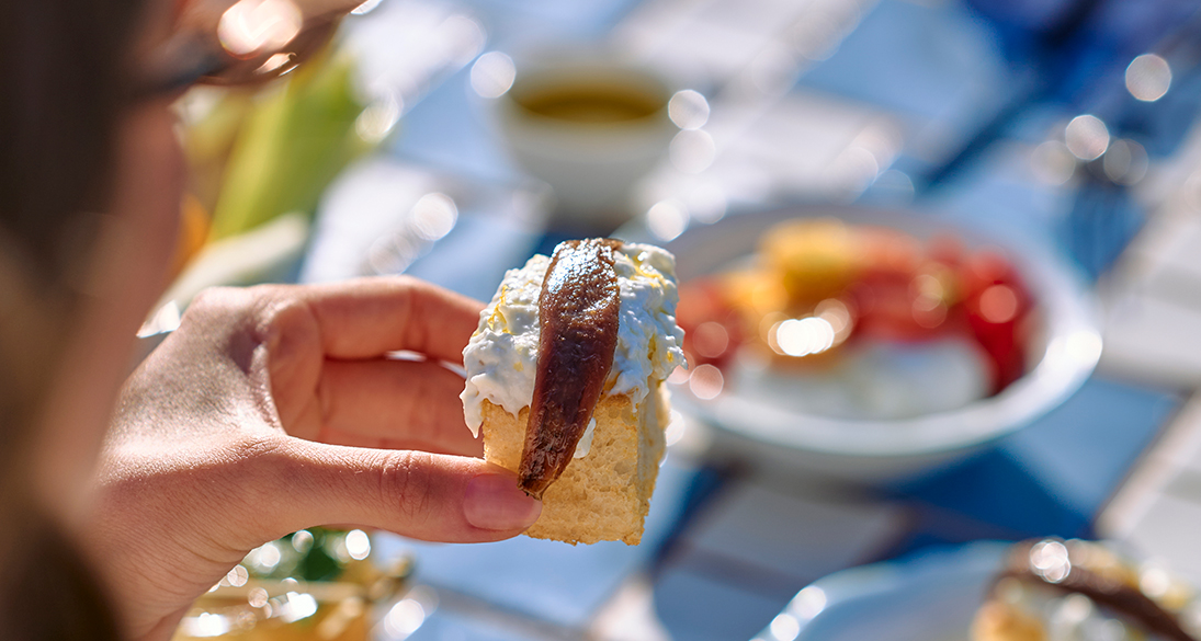 a hand holding a piece of food