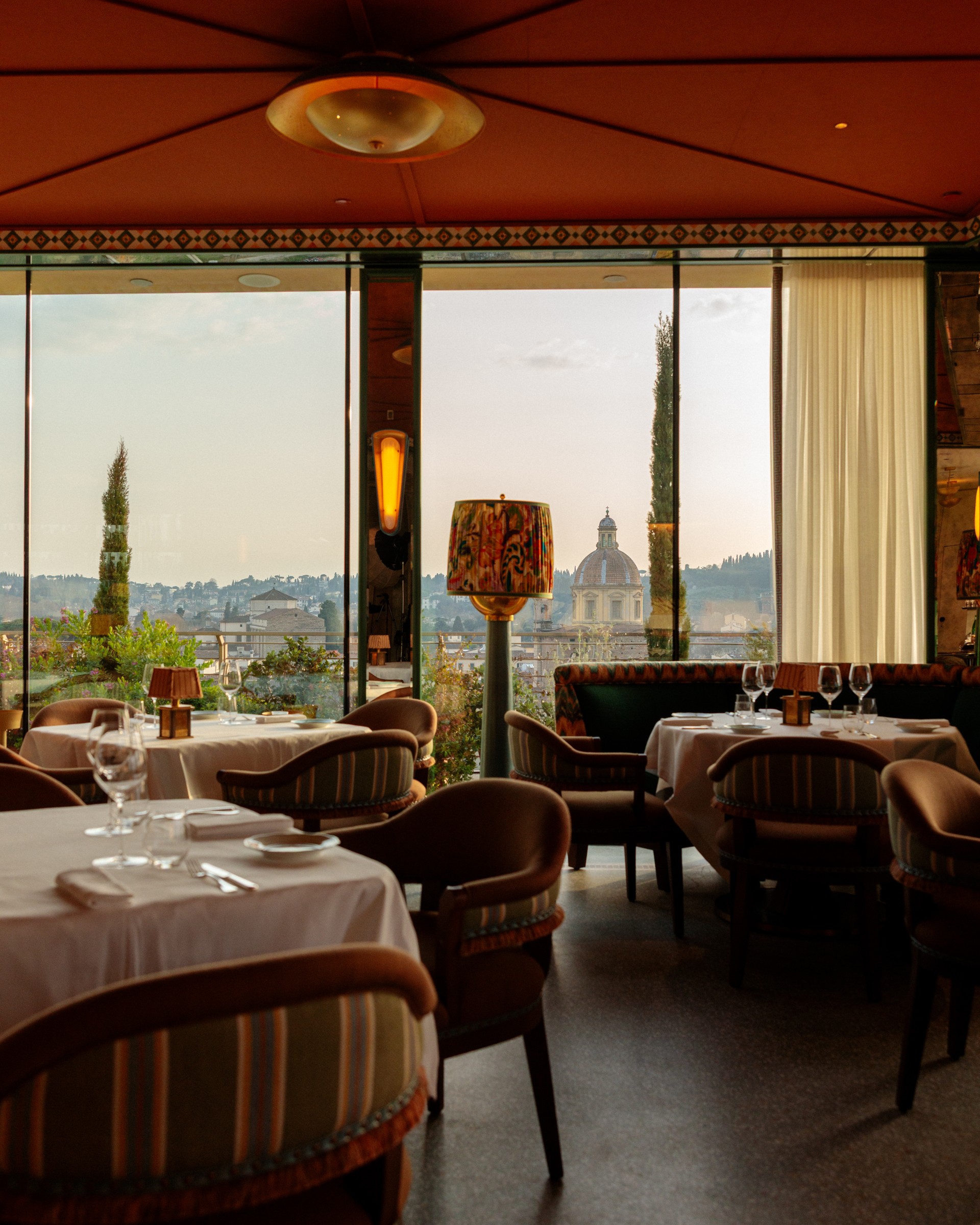 a restaurant with tables and chairs