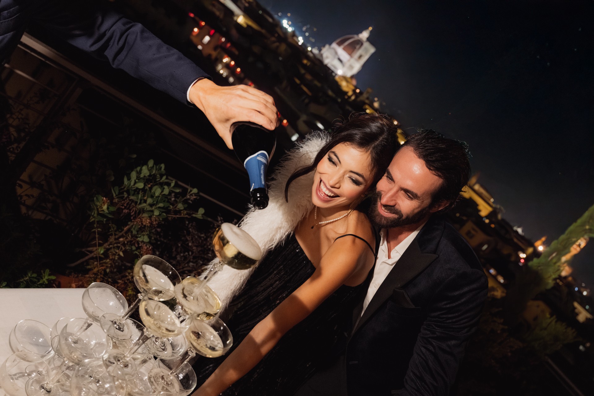 a man pouring champagne into a woman's face