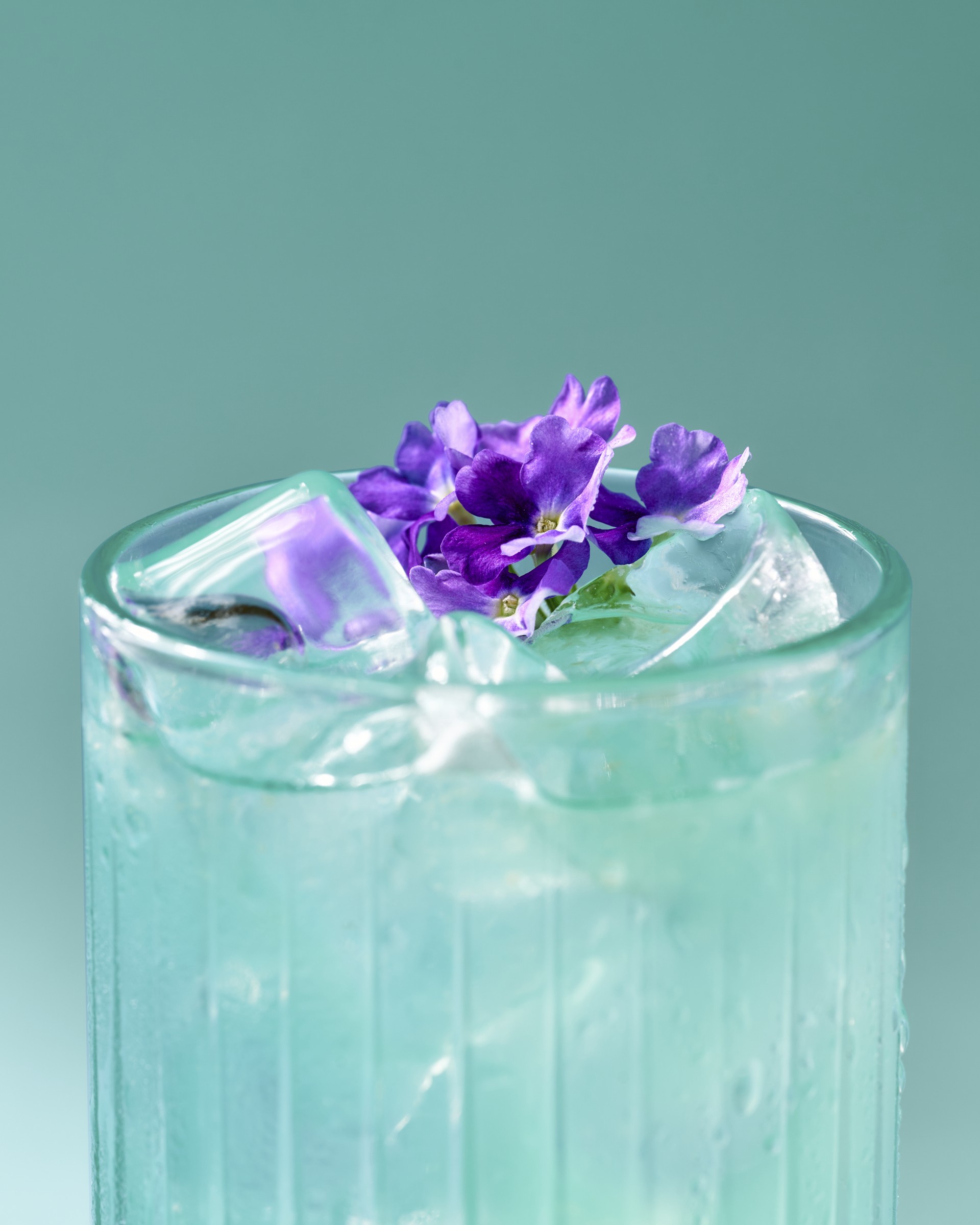 a glass with ice and flowers