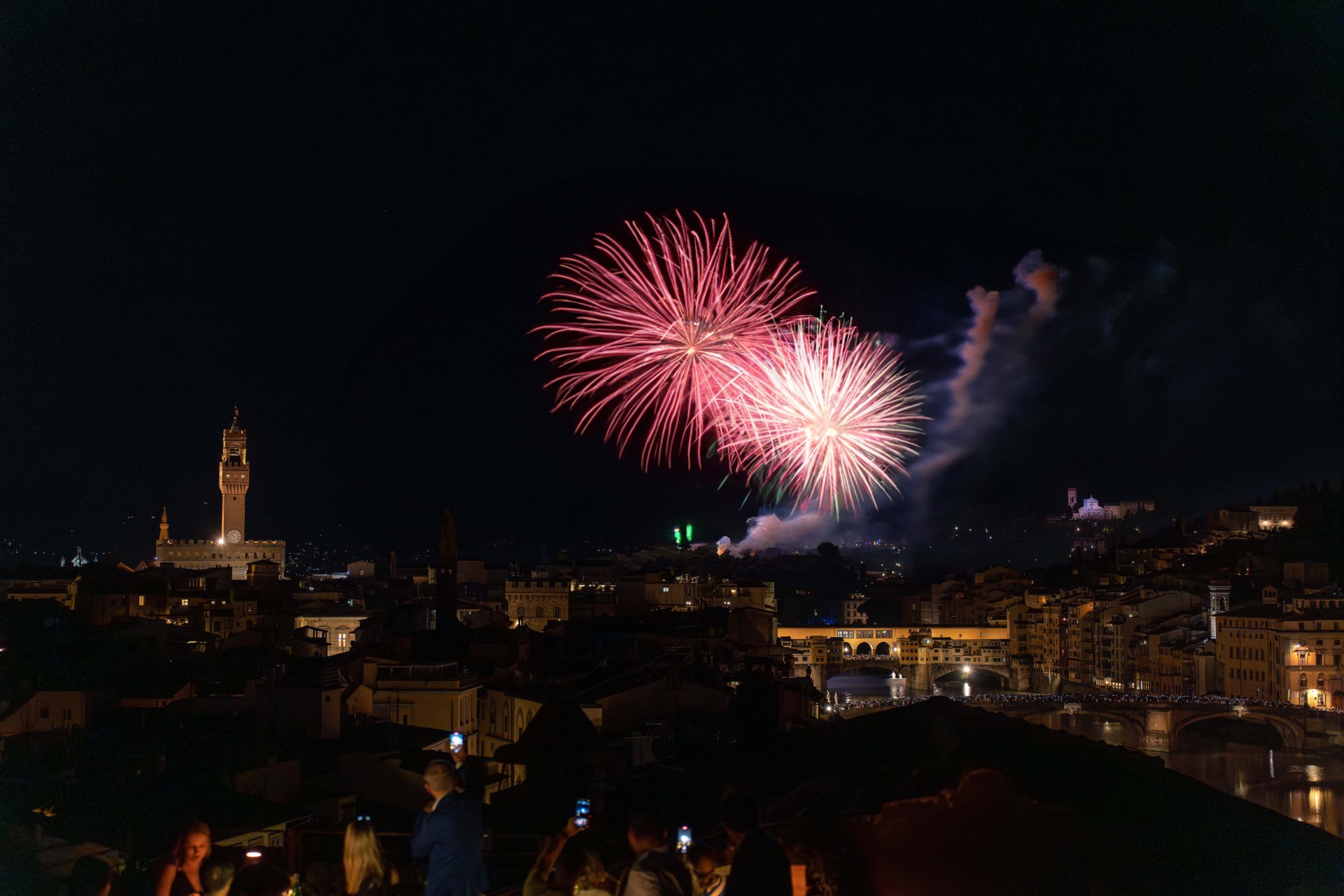 fireworks in the sky over a city