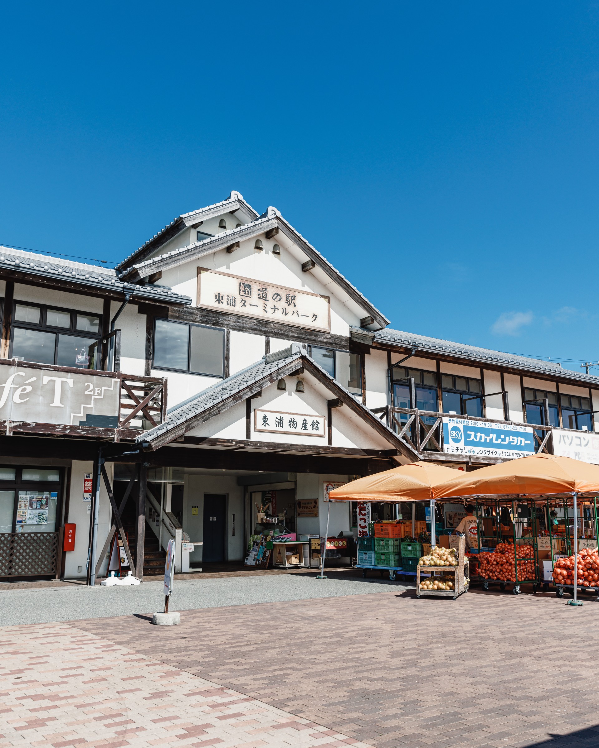 a building with fruit and vegetables outside