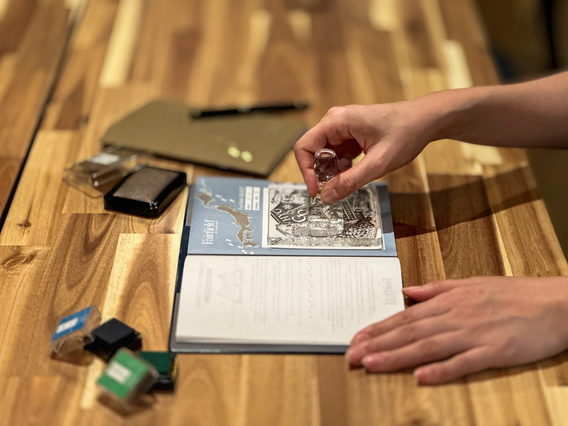 a person putting a stamp on a book