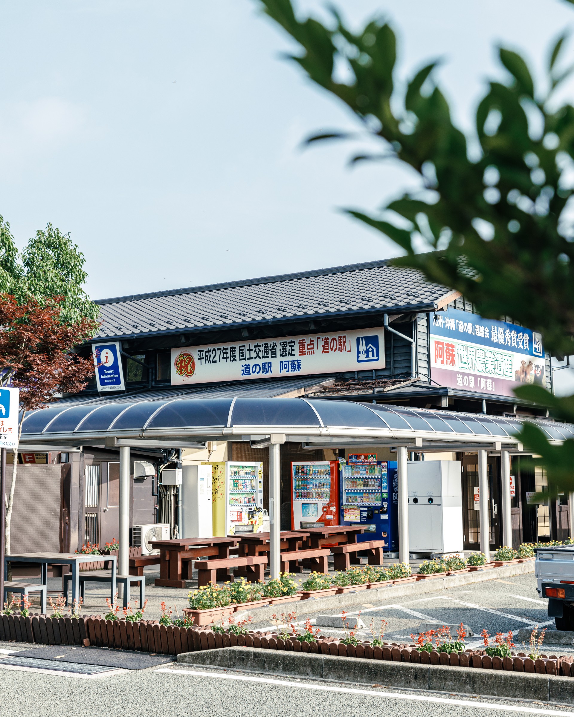 a building with a sign and a parking lot