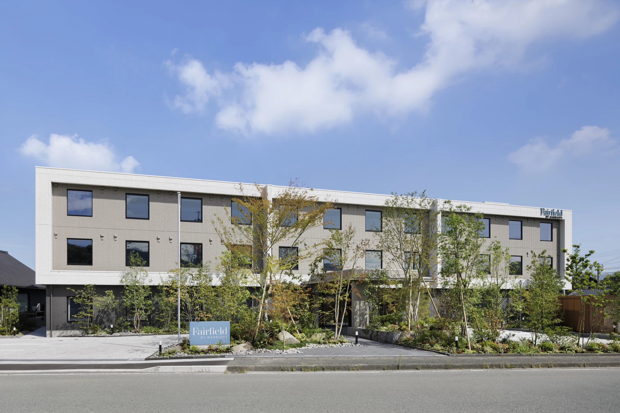 a building with trees and plants in front of it