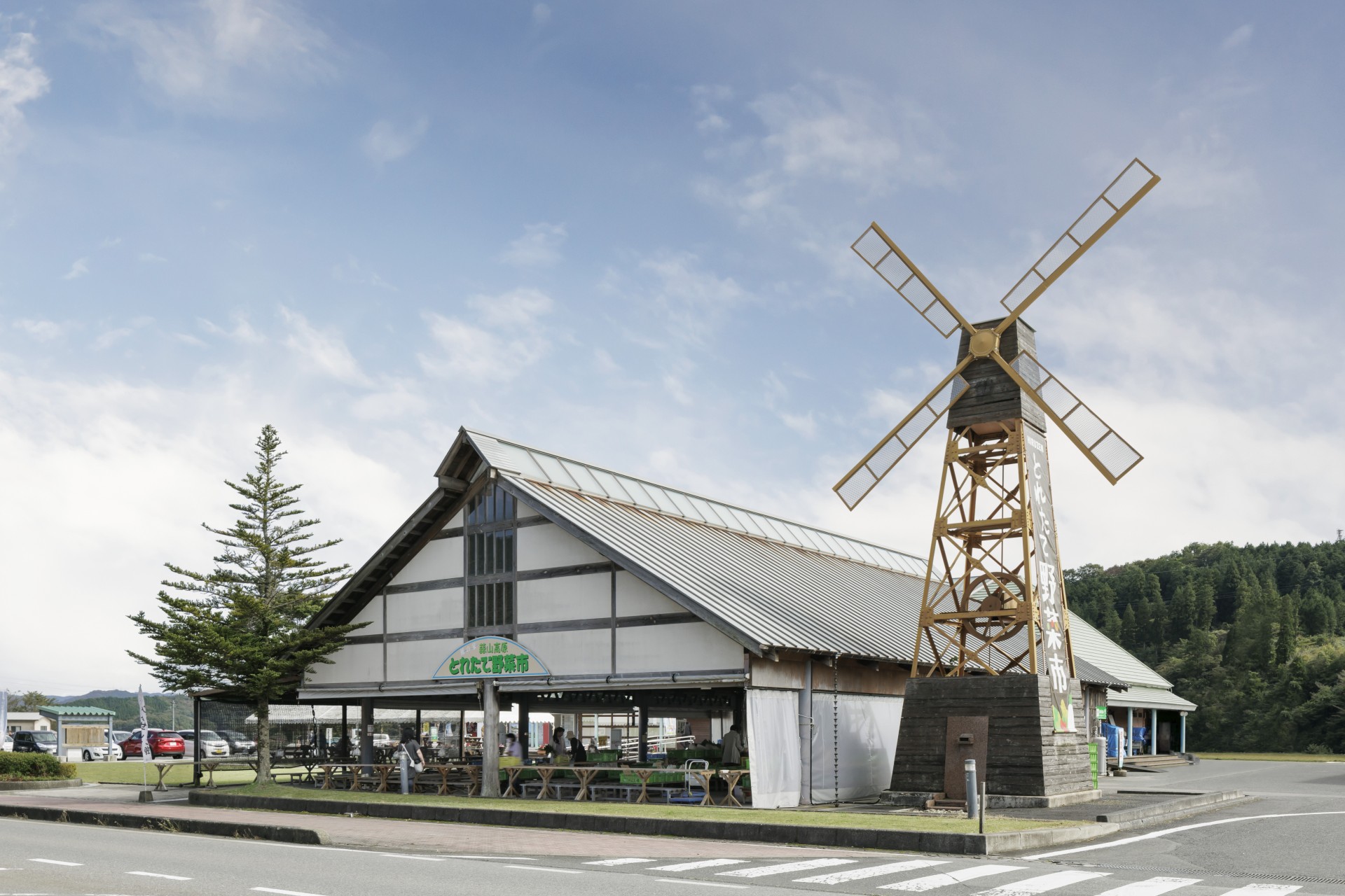 a windmill in front of a building