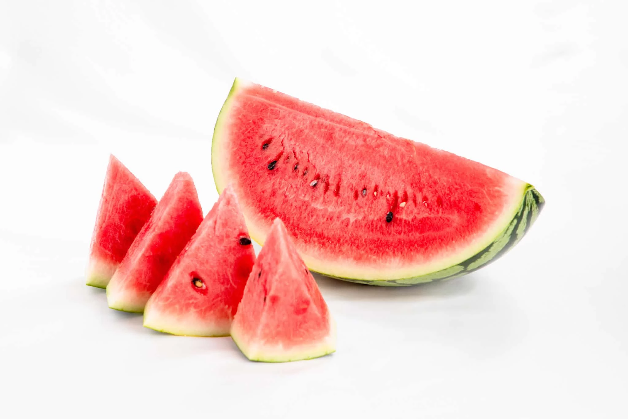 a watermelon and slices of watermelon